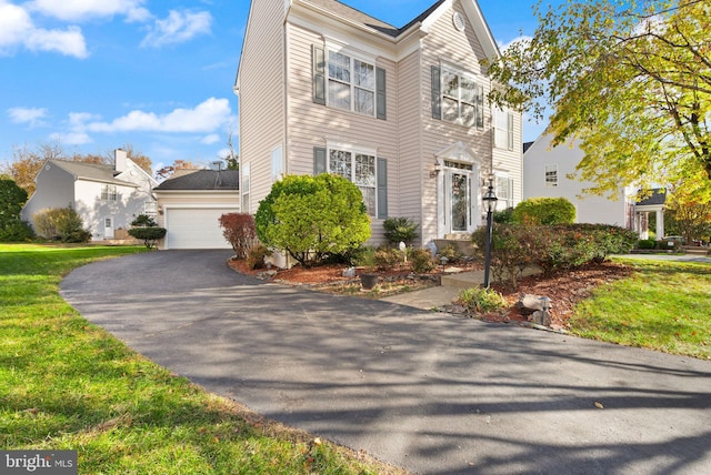 25336 Ripleys Field Dr, Chantilly, VA 20152 - view of front facade with a garage and a front lawn