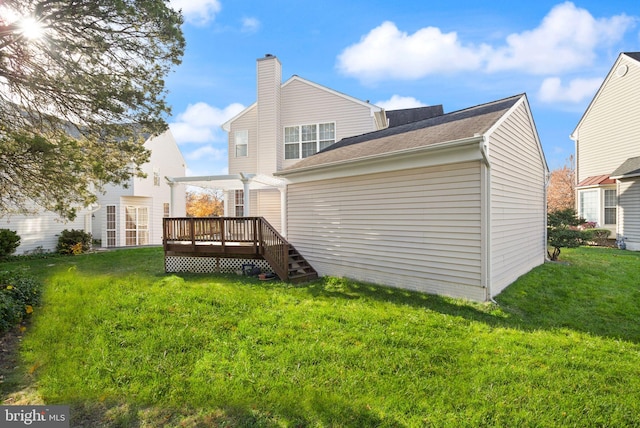 25336 Ripleys Field Dr, Chantilly, VA 20152 - rear view of house featuring a deck, a yard, and a chimney