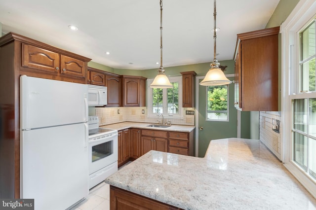21 Jerrys Ave, Clayton, NJ 08312 - kitchen with white appliances, decorative backsplash, a peninsula, light stone counters, and decorative light fixtures
