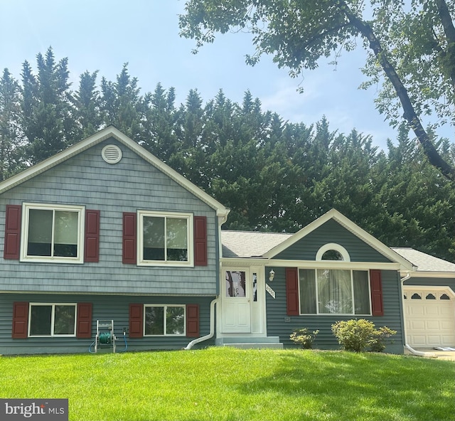6250 Fairbourne Ct, Hanover, MD 21076 - split level home featuring a front lawn and an attached garage