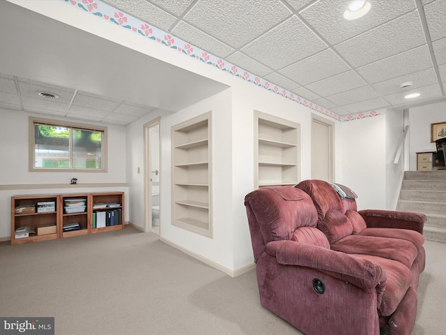 6250 Fairbourne Ct, Hanover, MD 21076 - sitting room with a drop ceiling, built in features, stairway, and carpet flooring