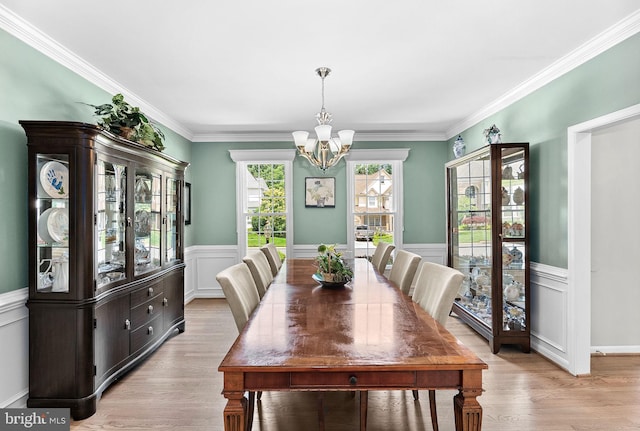 43251 Brownstone Ct, Ashburn, VA 20147 - dining room with a chandelier, a wainscoted wall, light wood-type flooring, and crown molding