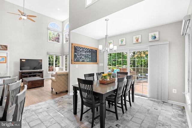 43251 Brownstone Ct, Ashburn, VA 20147 - dining room with a chandelier, a ceiling fan, and a high ceiling
