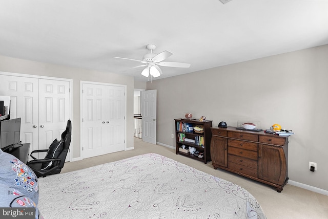 43251 Brownstone Ct, Ashburn, VA 20147 - bedroom featuring light colored carpet, two closets, and ceiling fan