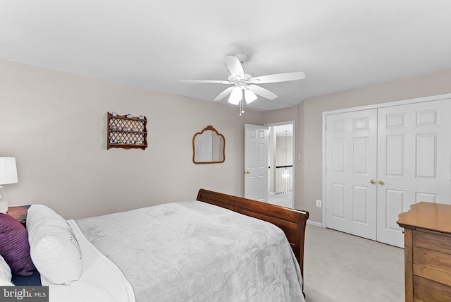 43251 Brownstone Ct, Ashburn, VA 20147 - bedroom featuring light colored carpet, a closet, and a ceiling fan