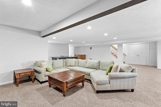 43251 Brownstone Ct, Ashburn, VA 20147 - living room with recessed lighting, light colored carpet, stairs, and a textured ceiling