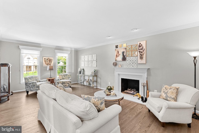 43251 Brownstone Ct, Ashburn, VA 20147 - living room with crown molding, wood finished floors, and a brick fireplace