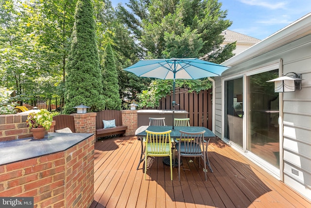 43251 Brownstone Ct, Ashburn, VA 20147 - wooden terrace featuring outdoor dining space