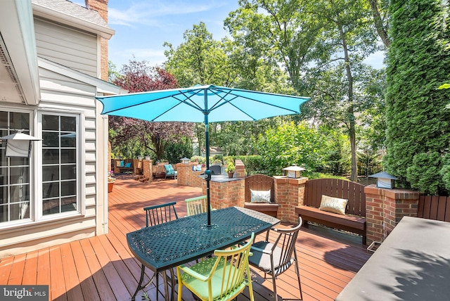 43251 Brownstone Ct, Ashburn, VA 20147 - wooden deck with outdoor dining space, an outdoor living space, and view of wooded area