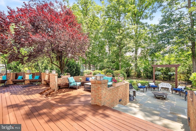 43251 Brownstone Ct, Ashburn, VA 20147 - wooden terrace with an outdoor living space with a fire pit and a patio area