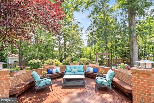 43251 Brownstone Ct, Ashburn, VA 20147 - wooden deck featuring an outdoor hangout area and view of wooded area