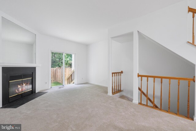 5840 Wescott Hills Way, Alexandria, VA 22315 - unfurnished living room featuring carpet flooring and a fireplace with flush hearth