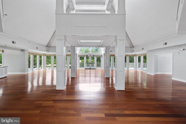 5840 Wescott Hills Way, Alexandria, VA 22315 - unfurnished living room with high vaulted ceiling, healthy amount of natural light, decorative columns, and wood finished floors
