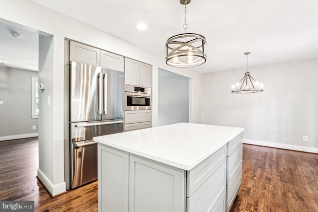 4711 Pontiac Dr, Annandale, VA 22003 - kitchen featuring appliances with stainless steel finishes, a chandelier, a center island, dark wood-type flooring, and recessed lighting