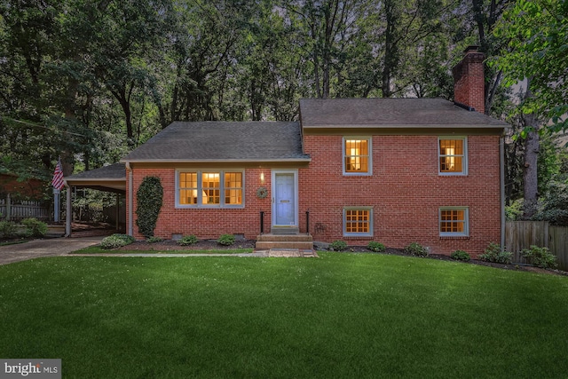 4711 Pontiac Dr, Annandale, VA 22003 - view of front facade with brick siding, a chimney, driveway, a shingled roof, and an attached carport