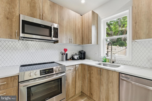 2246 N Hancock St, Philadelphia, PA 19133 - kitchen with stainless steel appliances, decorative backsplash, modern cabinets, and light stone countertops