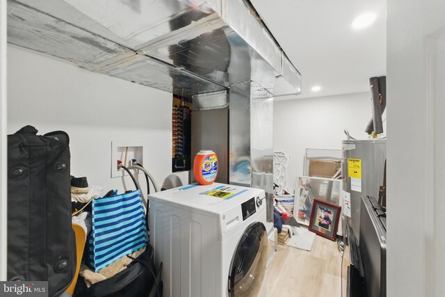 2246 N Hancock St, Philadelphia, PA 19133 - laundry room with washer / clothes dryer, water heater, wood finished floors, and recessed lighting