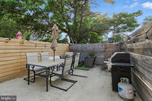 2246 N Hancock St, Philadelphia, PA 19133 - fenced backyard with outdoor dining space, a patio area, and a grill