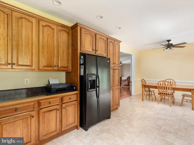 364 Stoney Bottom Rd, Front Royal, VA 22630 - kitchen with black refrigerator with ice dispenser, brown cabinetry, dark countertops, ceiling fan, and recessed lighting