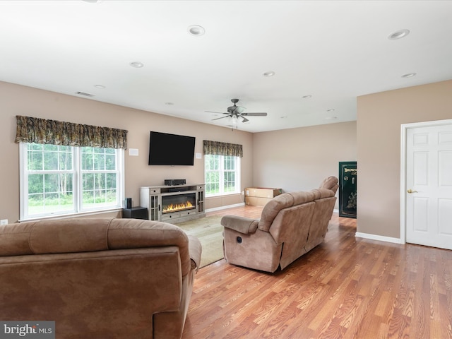 364 Stoney Bottom Rd, Front Royal, VA 22630 - living room with light wood finished floors, ceiling fan, a glass covered fireplace, and recessed lighting