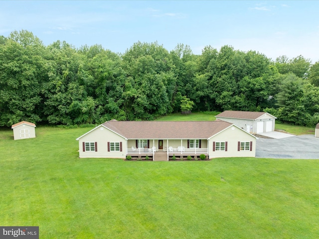 364 Stoney Bottom Rd, Front Royal, VA 22630 - single story home with covered porch, a front lawn, a detached garage, a storage unit, and a shingled roof