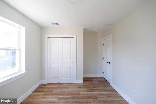 6827 Highland Ave, Pennsauken, NJ 08110 - unfurnished bedroom with a closet and light wood-style flooring
