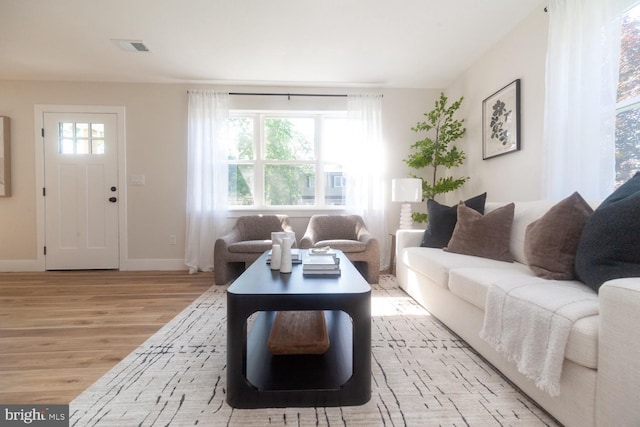 6827 Highland Ave, Pennsauken, NJ 08110 - living area with light wood-style floors and baseboards