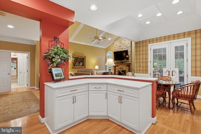 130 Piqua Cir Unit 30, Berwyn, PA 19312 - kitchen with a ceiling fan, light wood-style flooring, a fireplace, lofted ceiling, and open floor plan