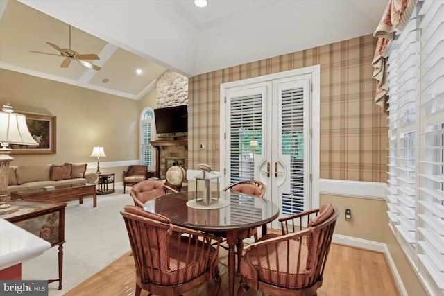 130 Piqua Cir Unit 30, Berwyn, PA 19312 - dining area featuring french doors, vaulted ceiling, ceiling fan, light wood-style flooring, and a fireplace