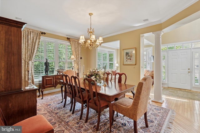 130 Piqua Cir Unit 30, Berwyn, PA 19312 - dining area with decorative columns, a chandelier, ornamental molding, and light wood-style floors