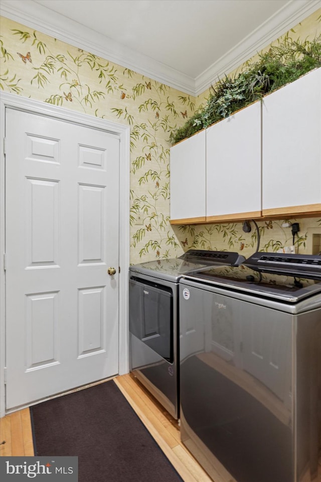 130 Piqua Cir Unit 30, Berwyn, PA 19312 - washroom featuring cabinet space, wallpapered walls, washer and clothes dryer, ornamental molding, and light wood-style flooring