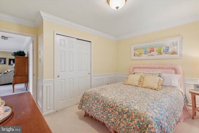 130 Piqua Cir Unit 30, Berwyn, PA 19312 - bedroom with crown molding, a decorative wall, carpet floors, a closet, and wainscoting