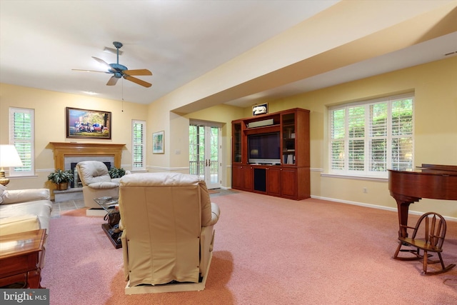 130 Piqua Cir Unit 30, Berwyn, PA 19312 - living room featuring ceiling fan, a fireplace with raised hearth, light colored carpet, and french doors