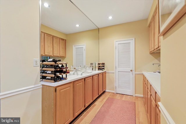 130 Piqua Cir Unit 30, Berwyn, PA 19312 - kitchen with light wood-style flooring, light brown cabinets, light countertops, and recessed lighting