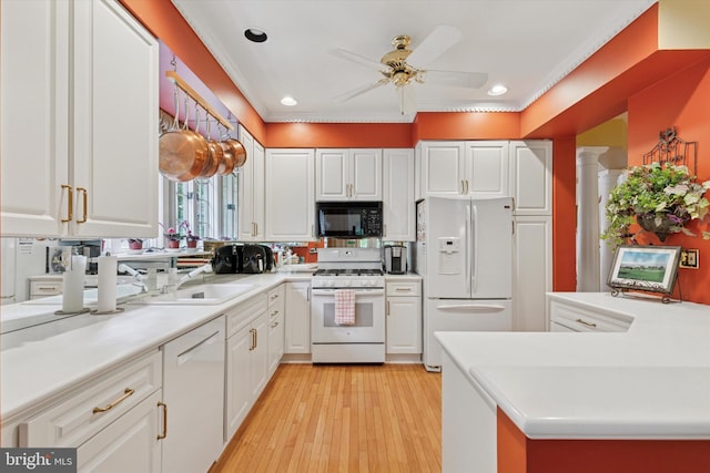 130 Piqua Cir Unit 30, Berwyn, PA 19312 - kitchen featuring white appliances, white cabinetry, ceiling fan, light wood-style floors, and light countertops