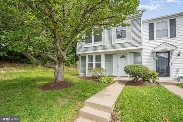 4730 Still Pl, Woodbridge, VA 22193 - townhome / multi-family property featuring a front yard