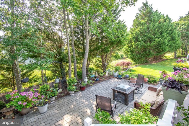 37126 Solitude Dr, Selbyville, DE 19975 - view of patio / terrace featuring a fire pit