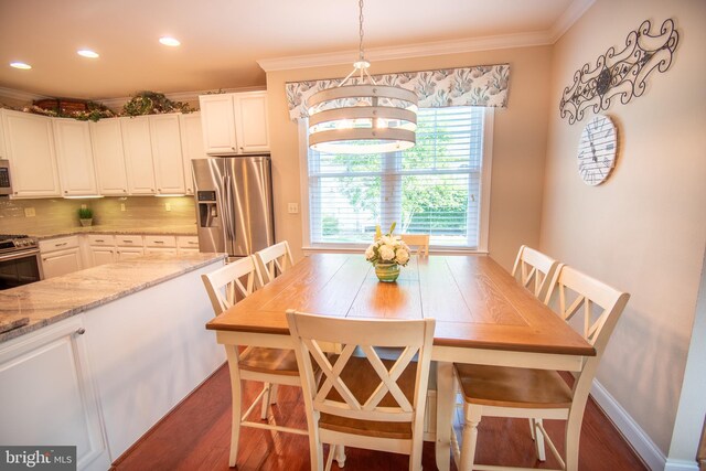 37126 Solitude Dr, Selbyville, DE 19975 - dining room with dark wood-style floors, ornamental molding, and recessed lighting