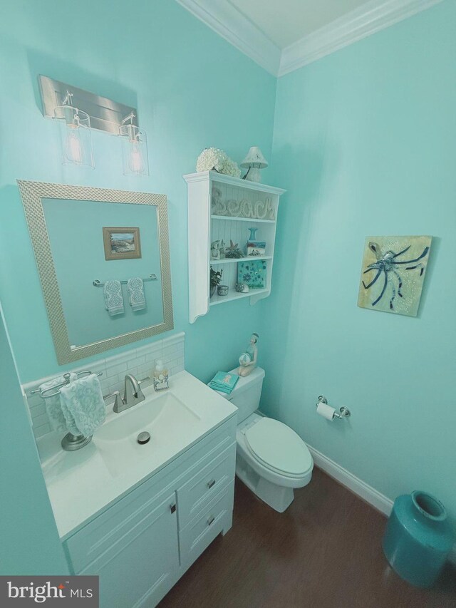 37126 Solitude Dr, Selbyville, DE 19975 - bathroom with wood finished floors, vanity, ornamental molding, and backsplash