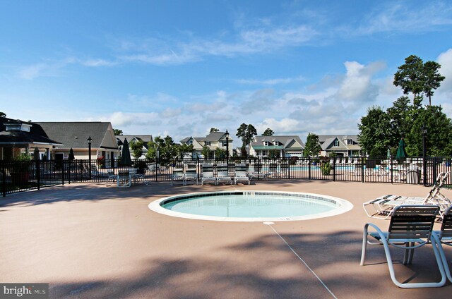 37126 Solitude Dr, Selbyville, DE 19975 - community pool featuring a residential view and a patio