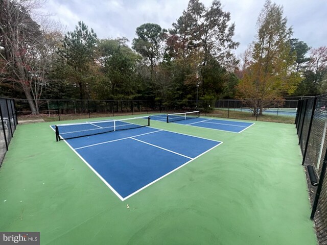 37126 Solitude Dr, Selbyville, DE 19975 - view of tennis court featuring community basketball court and view of wooded area