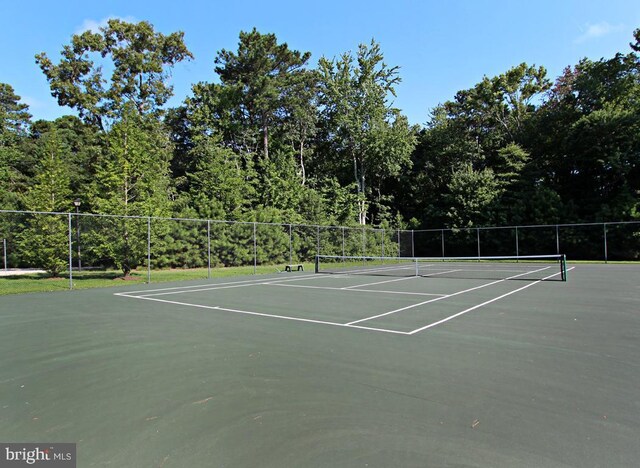 37126 Solitude Dr, Selbyville, DE 19975 - view of tennis court with community basketball court and a view of trees