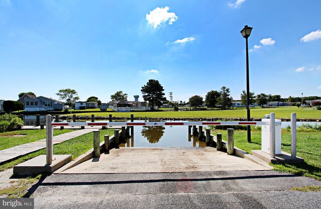 37126 Solitude Dr, Selbyville, DE 19975 - dock featuring a boat ramp, a yard, and a water view