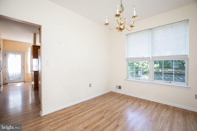 23 Navesink Dr, Pennington, NJ 08534 - empty room with light wood-style floors and a chandelier