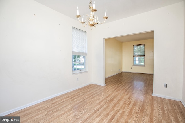 23 Navesink Dr, Pennington, NJ 08534 - spare room with a chandelier and light wood-style floors