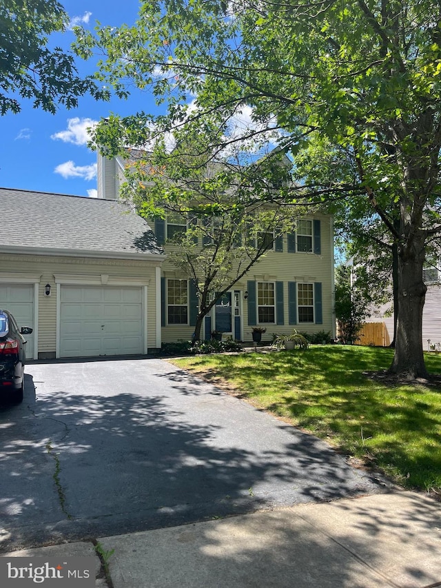 23 Navesink Dr, Pennington, NJ 08534 - view of front of property with asphalt driveway, a garage, and a chimney