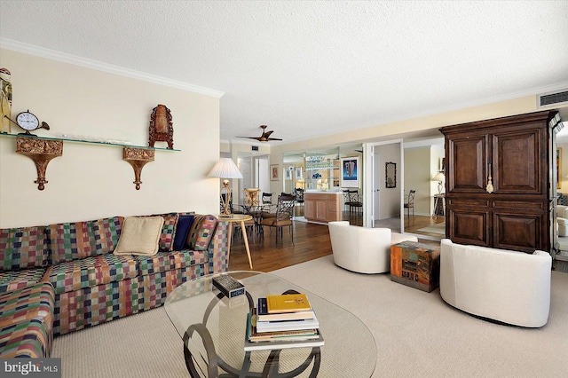 403 N Edgewater House Rd Unit 403N, Bethany Beach, DE 19930 - living room with ornamental molding, a textured ceiling, a ceiling fan, and wood finished floors