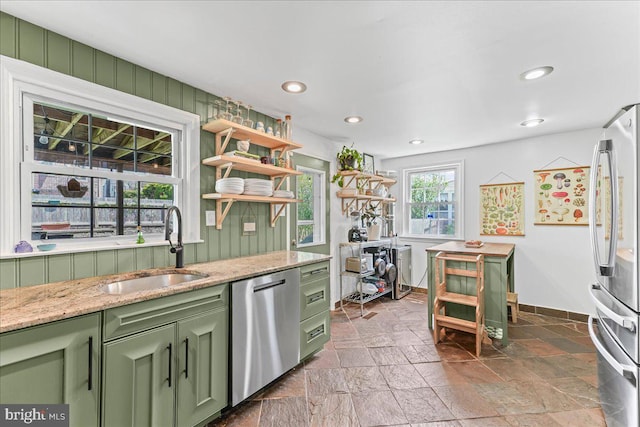 809 Addingham Ave, Drexel Hill, PA 19026 - kitchen with green cabinets, appliances with stainless steel finishes, stone tile flooring, open shelves, and light stone countertops
