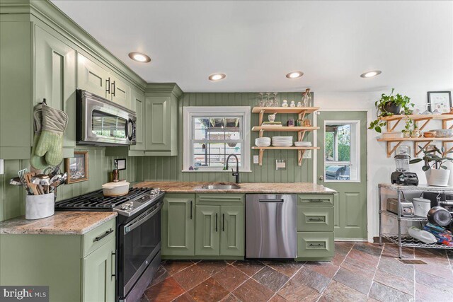 809 Addingham Ave, Drexel Hill, PA 19026 - kitchen with green cabinetry, stainless steel appliances, healthy amount of natural light, stone tile flooring, and recessed lighting