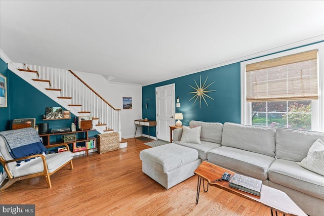 809 Addingham Ave, Drexel Hill, PA 19026 - living area featuring wood finished floors, stairway, and ornamental molding